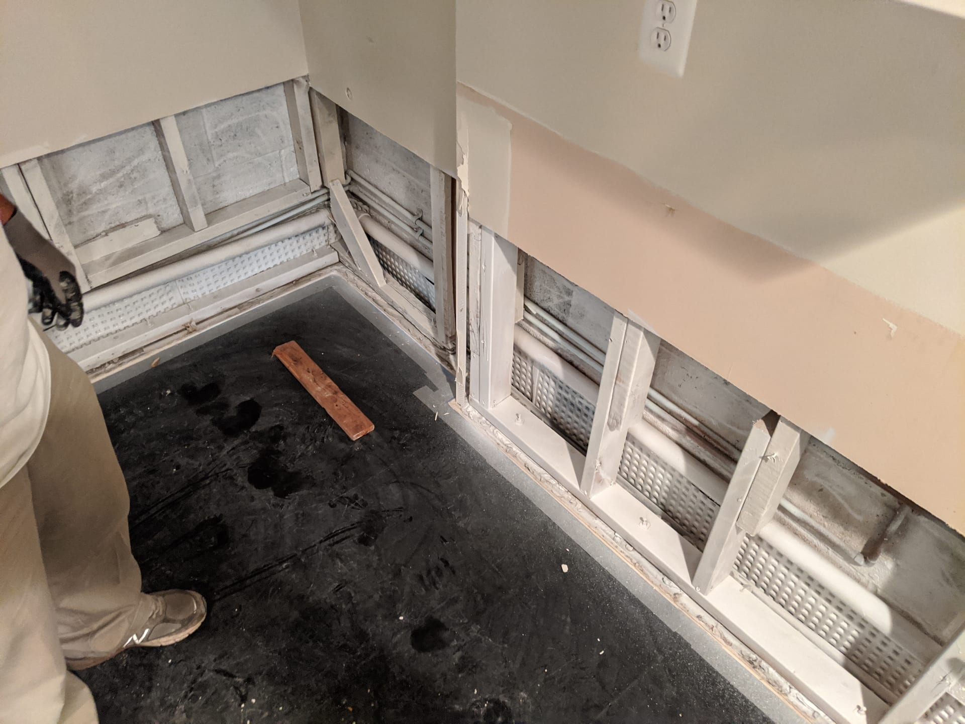Fresh white sealed studs ready for insulation and drywall