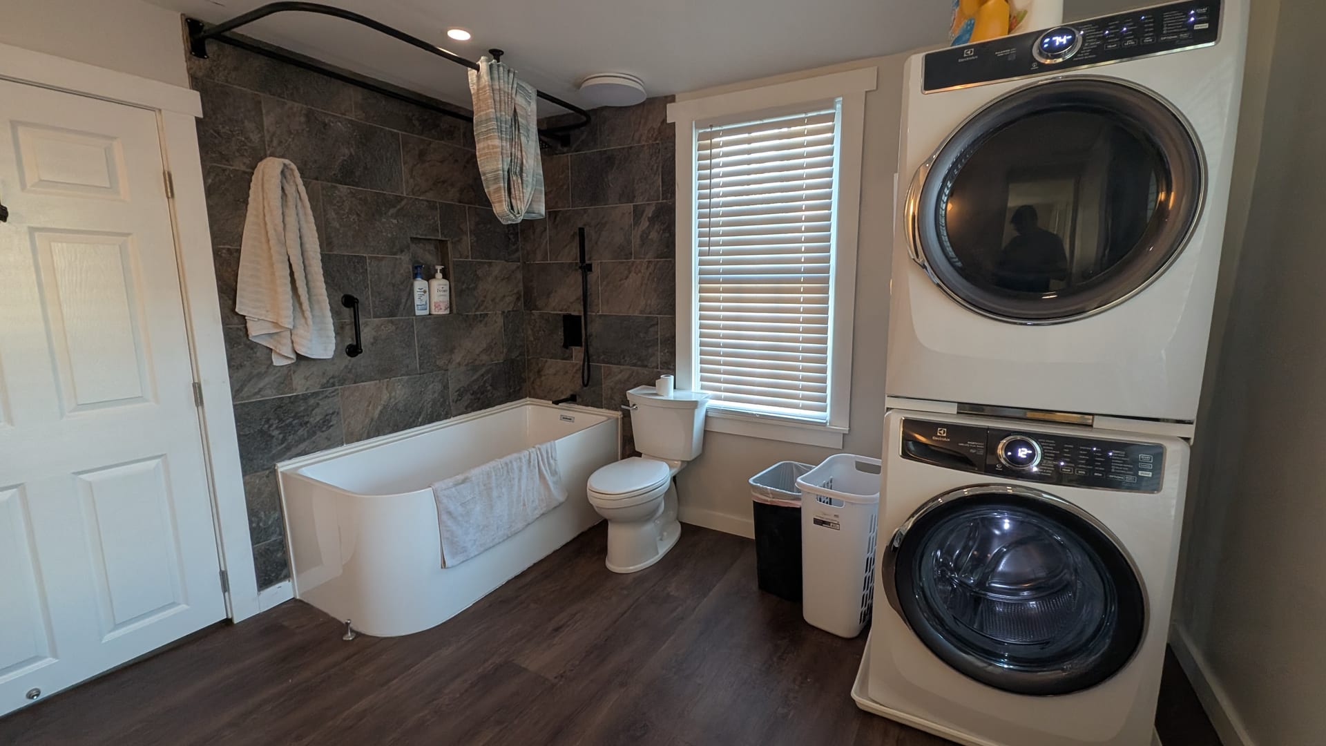 Finished luxury bathroom with tile shower and modern fixtures